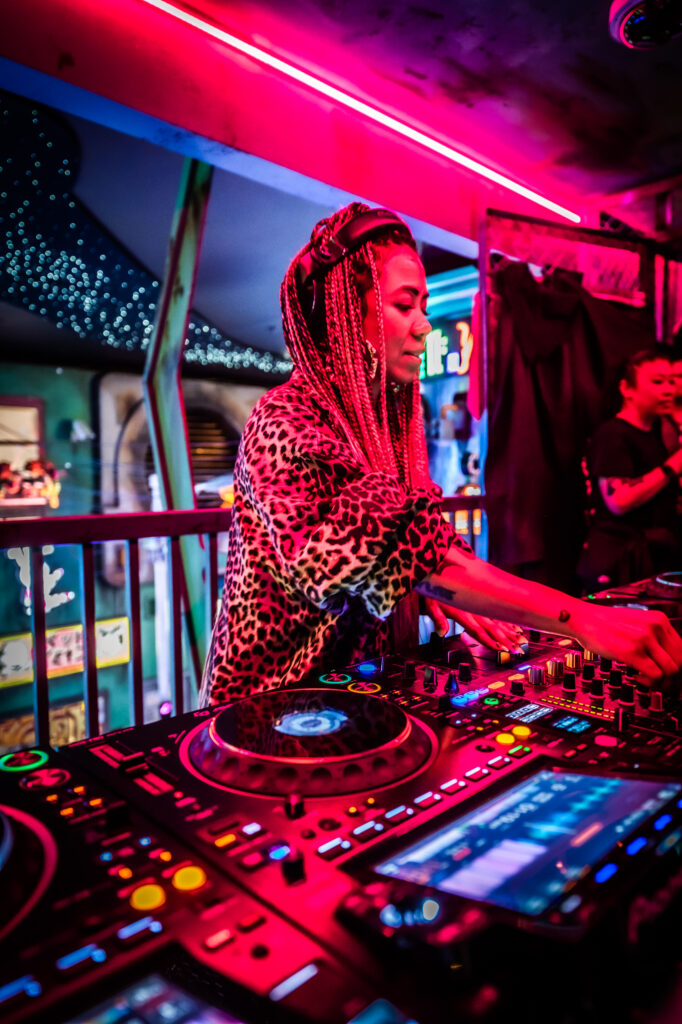 photo of a black woman DJ performing