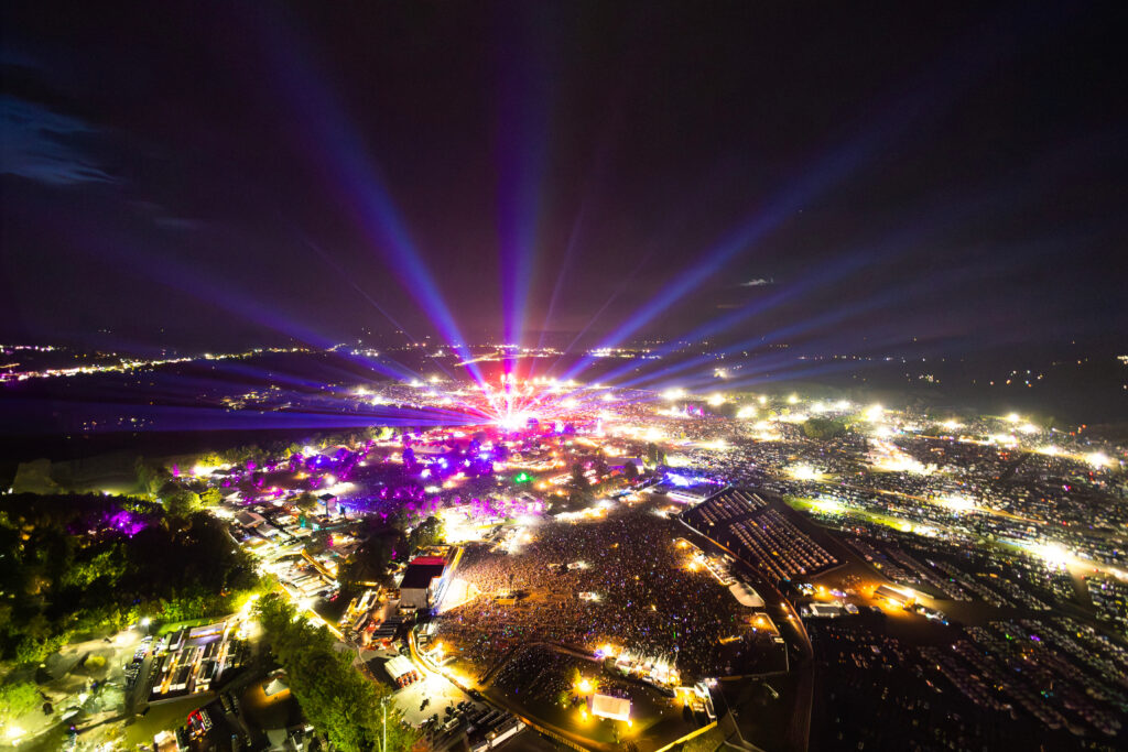 Festival crowds illuminated by lights