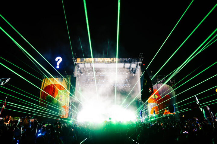 LAsers shooting out from a festival stage.