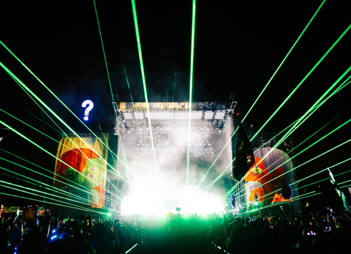 LAsers shooting out from a festival stage.