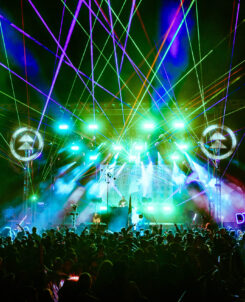 Photo of a festival stage with lasers.