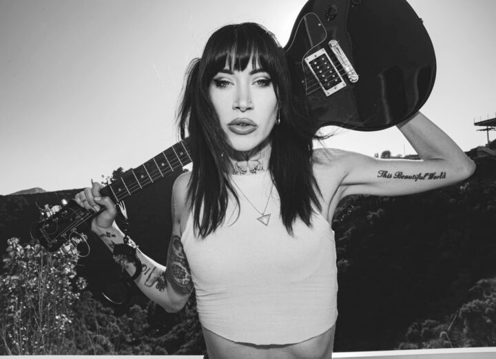 Leach Culver Press Photo black and white holding guitar behind head