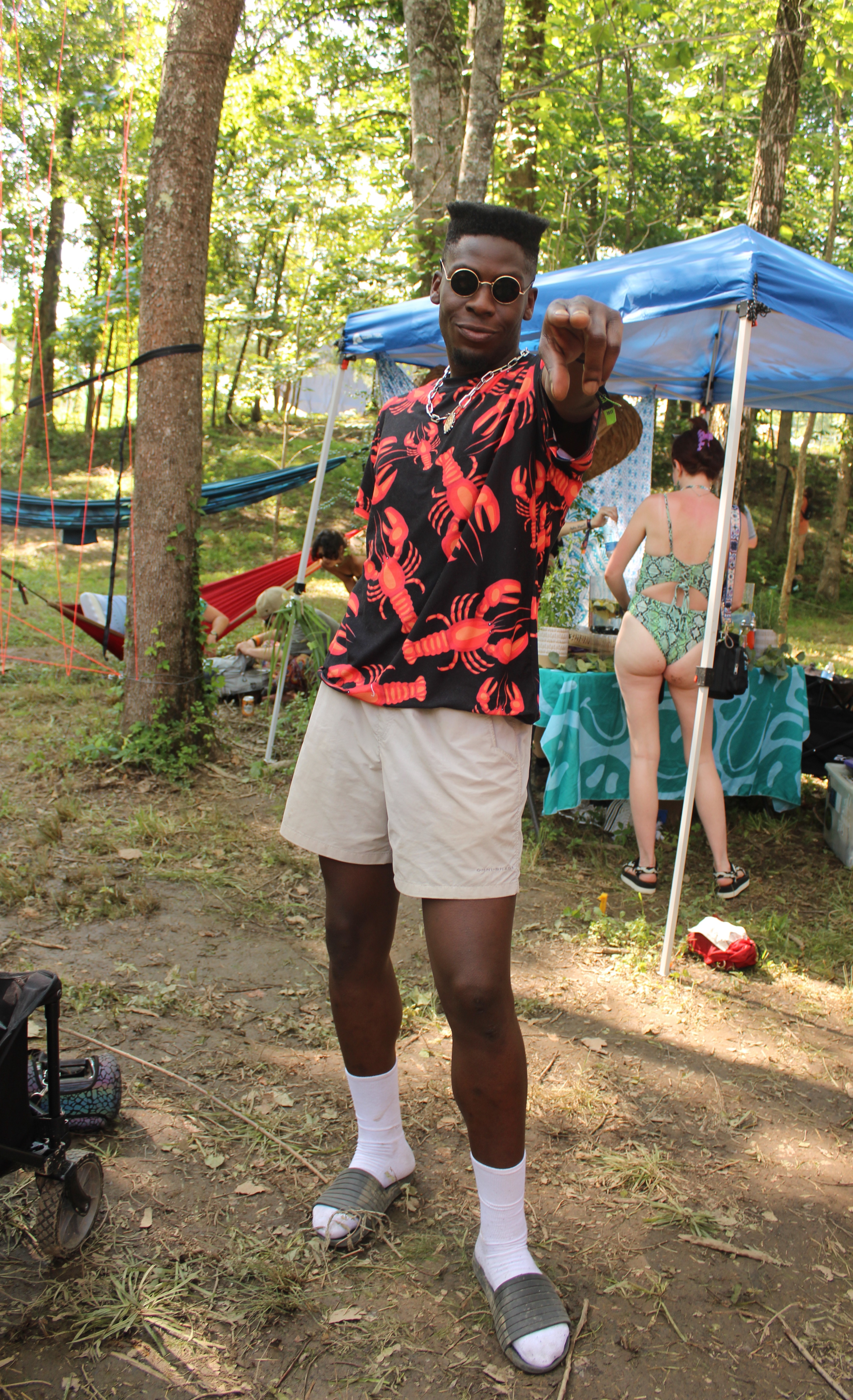 Festival fashion 2023: man with flat top haircut wearing a black and red lobster t-shirt