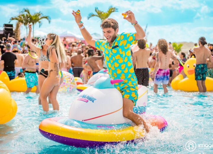 Imagine Music Festival pool party: man in duck shirt floating in pool