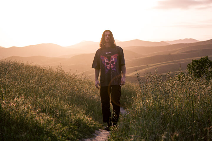 Meduso press shot: walking in grassy hills in California at sunset