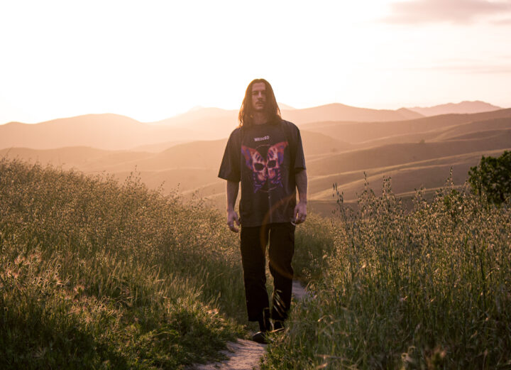Meduso press shot: walking in grassy hills in California at sunset