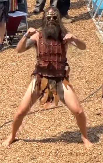 Festival fashion 2023: Funny-looking dude with huge beard and gladiator attire