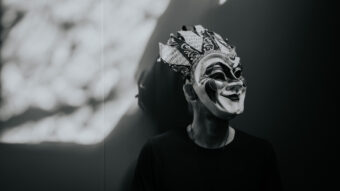 Boris Brejcha black and white press photo with his signature joker mask covering his face.