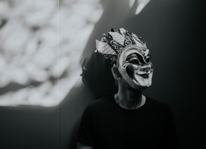 Boris Brejcha black and white press photo with his signature joker mask covering his face.