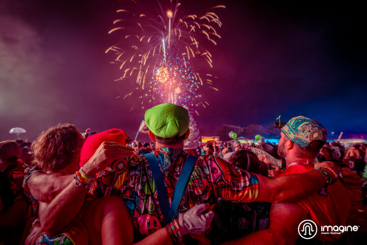 Imagine Music Festival 2023: 3 Friends watching fireworks over the crowd.