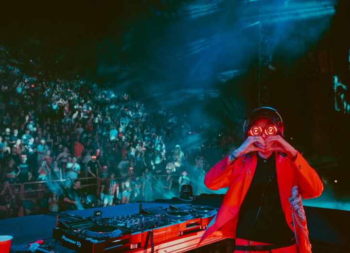 Photo of REZZ throwing up heart sign at Red Rocks