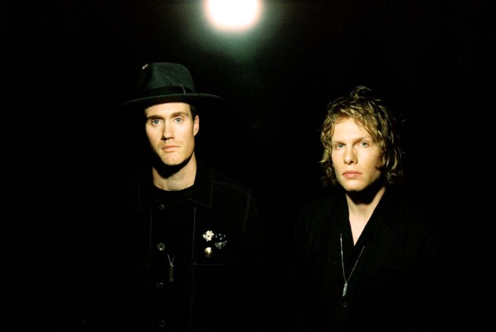 Bob Moses press shot: both members wearing all black, posing under bright white light.