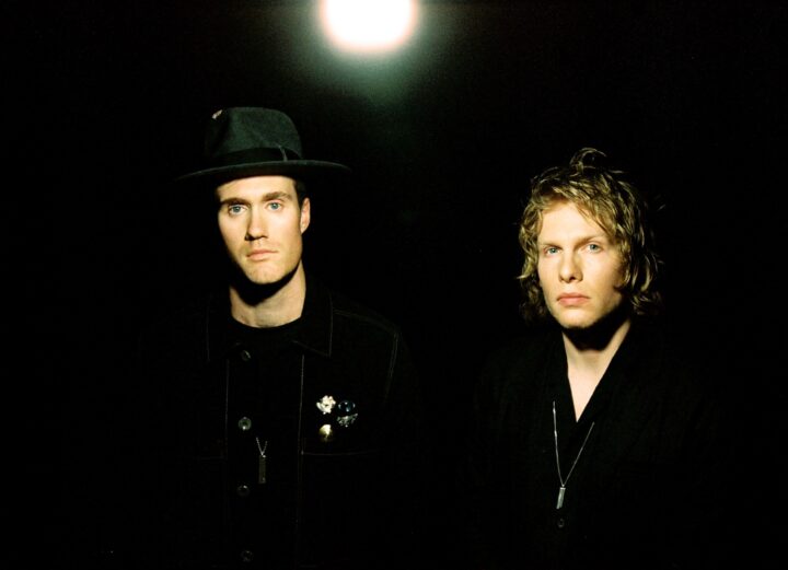 Bob Moses press shot: both members wearing all black, posing under bright white light.