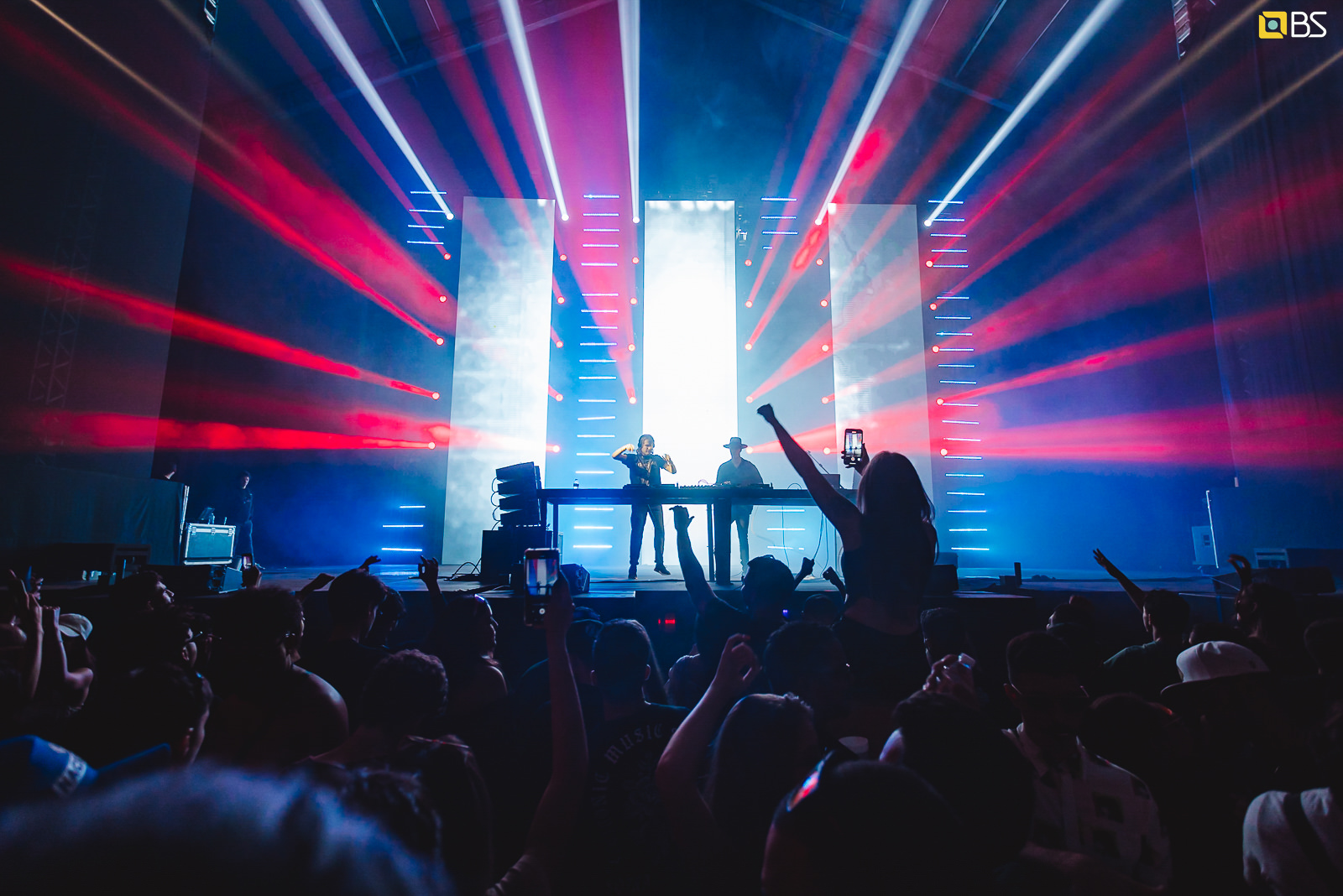 Bob Moses on stage with blue and red strobe lights