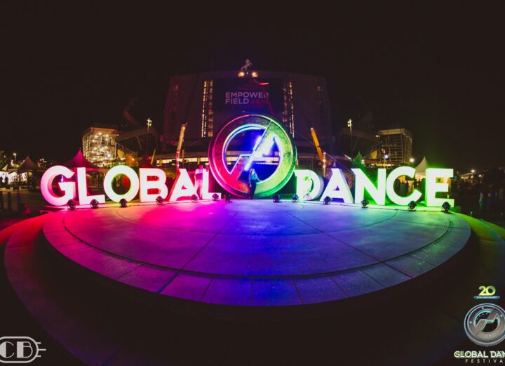 Global Dance light up LED sign in rainbow colors.