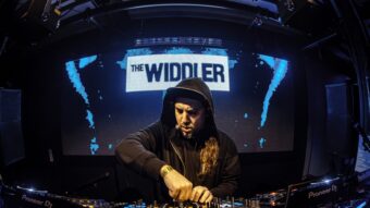 The Widdler playing a DJ set on stage