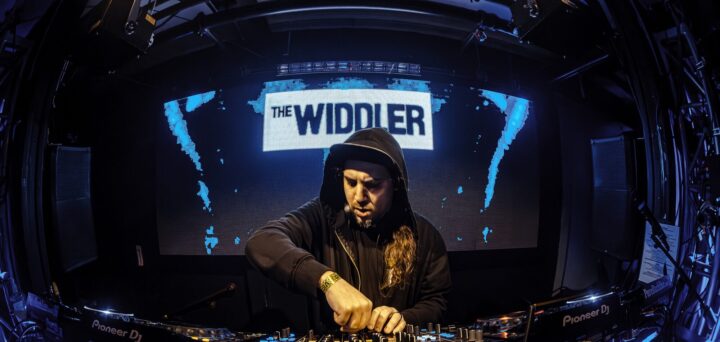 The Widdler playing a DJ set on stage