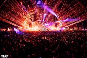 Escape Halloween stage with massive crowd and purple lights