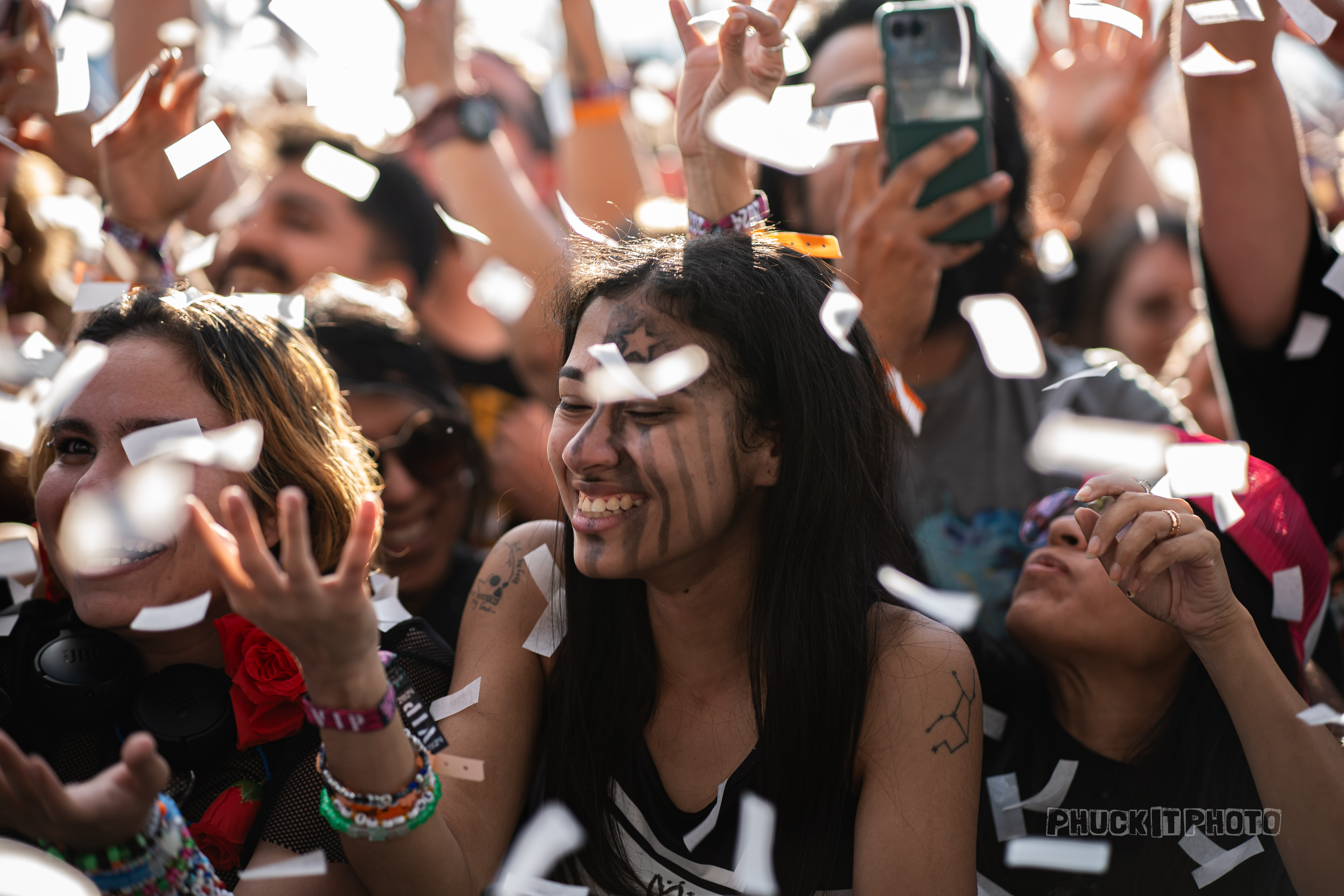 Joyful festival goers after a confetti blast