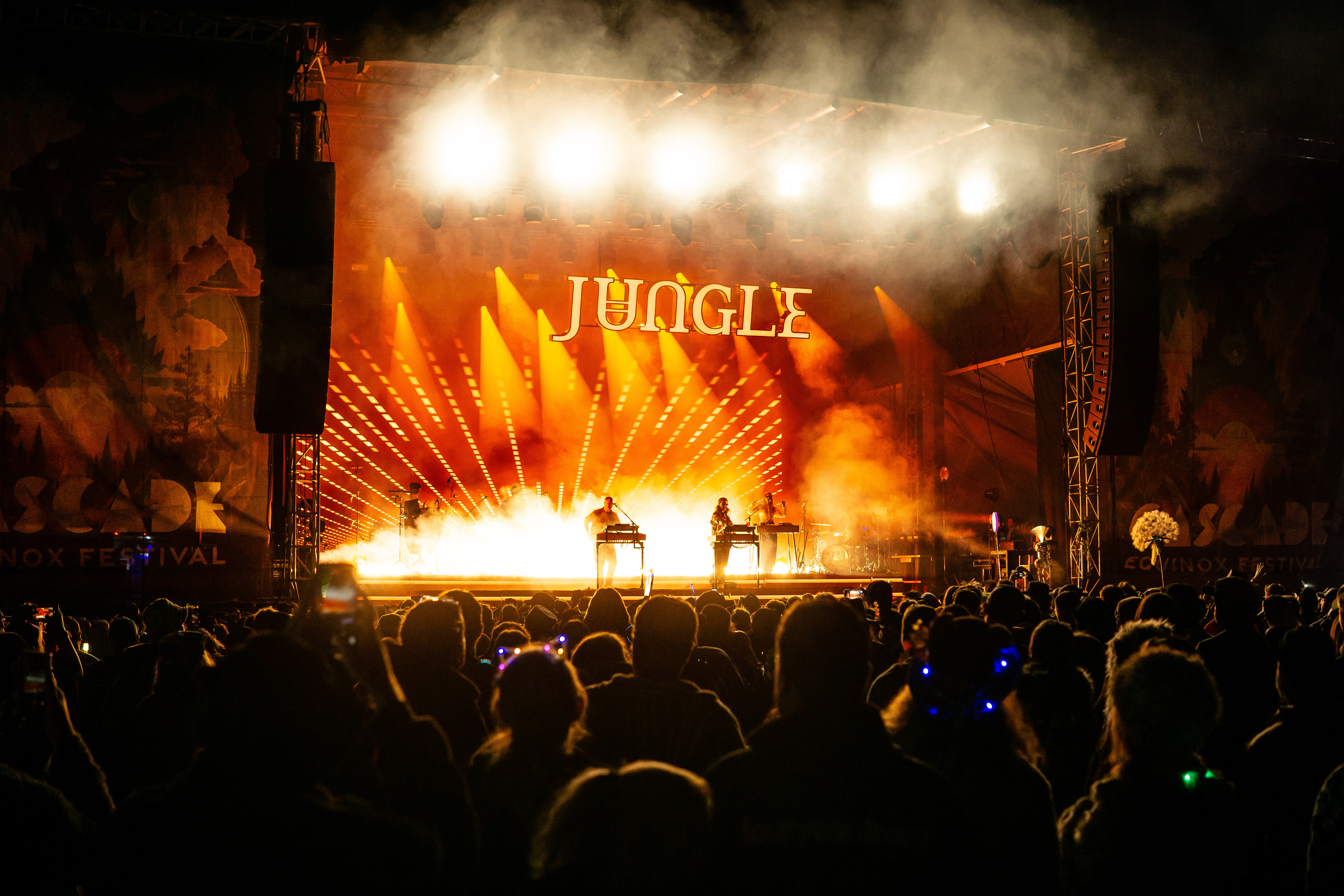 Jungle paying music with bright lights and a large crowd at Cascade Equinox